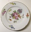 Assiette - bouquet de fleurs central et semis de huit fleurs polychromes<br>