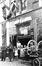 Photo Rue Saint-Martin, manifestation carnavalesque devant le café de F. Van der Putten-Moentack (Molenbeek-Saint-Jean), photogr. anon., 1945.<br>