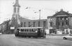 Photo Place de la Duchesse de Brabant, église Sainte-Barbe, Ecole communale 5 en construction et tram (Molenbeek-Saint-Jean), photogr. R. Temmerman (Ixelles), 1963.<br>
