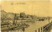 Carte-vue Port de Bruxelles, Quai du Batelage, chalands et grues, Avenue du Port et entrepôt de Tour & Taxis (Molenbeek-Saint-Jean), éd. P.J. Flion (Bruxelles), s.d. [vers 1920].<br>